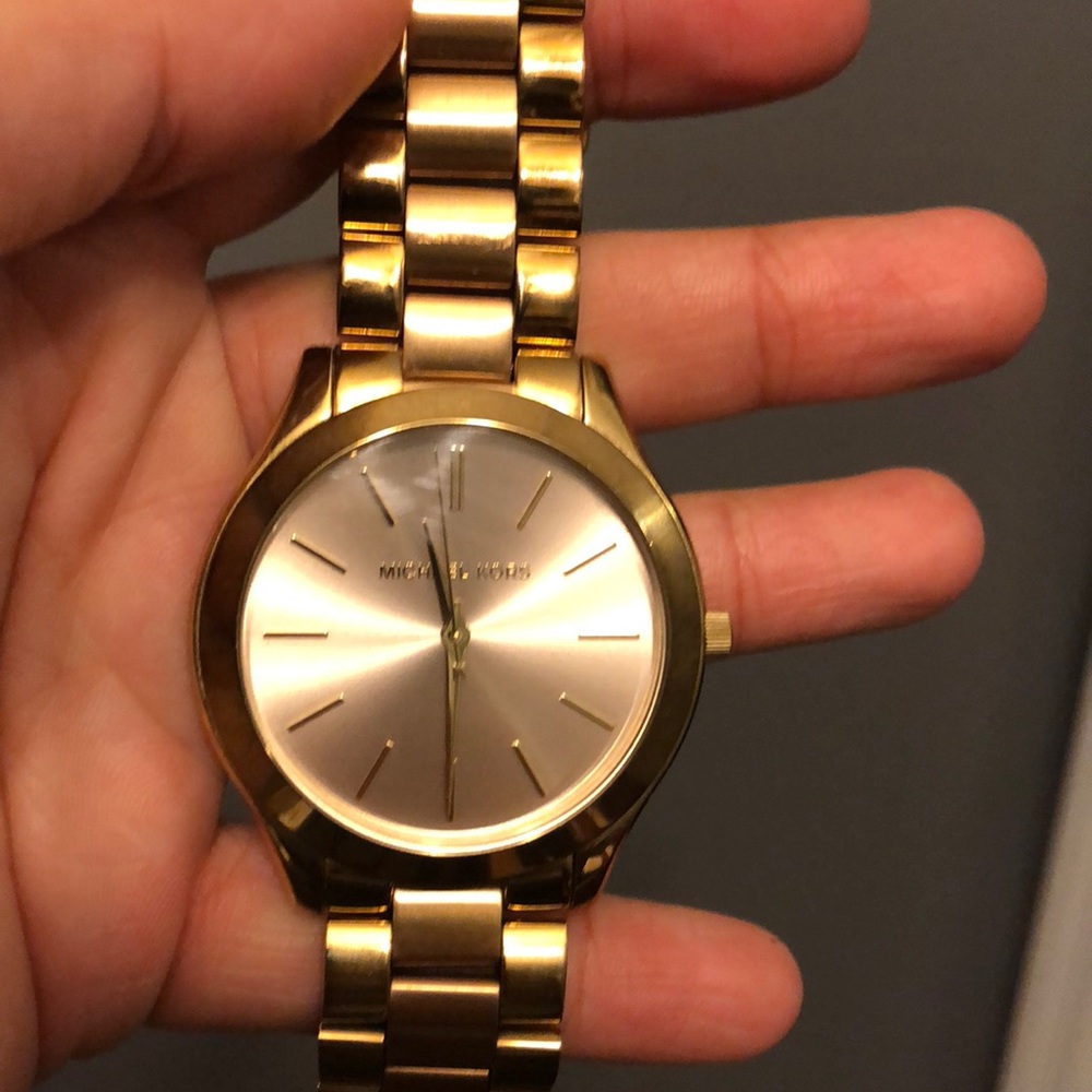 Michael Kors gold and rose gold watch.